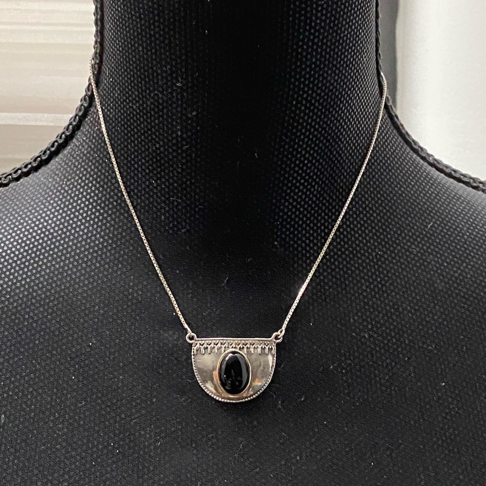 925 Sterling silver necklace with dark colored stone in center